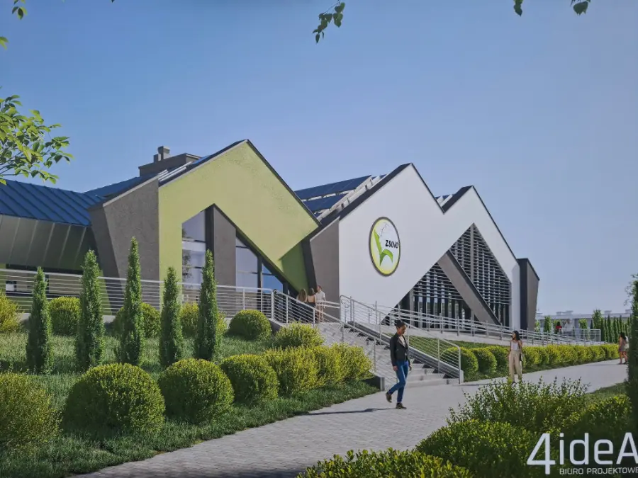 Wizualizacja wejścia do hali sportowej od strony szkoły: biała bryła z logo szkoły, zielony akcent i pochylnia